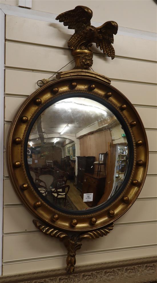 A Regency-style gilt-framed convex wall mirror W.59cm